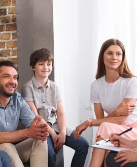 happy-family-sitting-on-therapy-session-by-female-7M4DL87.jpg